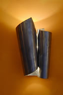 This sleek wall light design does not only provide functional lighting, it is shining downwards and also upwards. Lighting wall sconces can be used both indoors and outdoors of a home.
